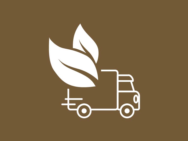 Ícone branco sobre fundo marrom representando um caminhão de entrega com duas folhas estilizadas saindo da carroceria, simbolizando transporte sustentável, logística ecológica ou entrega com baixa emissão de carbono