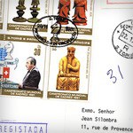 Imagem de 4 selos antigos em formato de quadra carimbados no meio